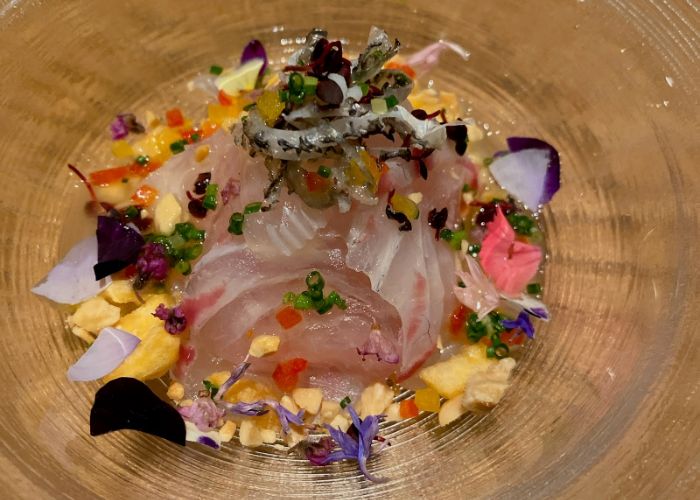 A delicately prepared dish at Kyou Seika, a Michelin star Chinese restaurant in Kyoto. It is decorated with flowers and petals.